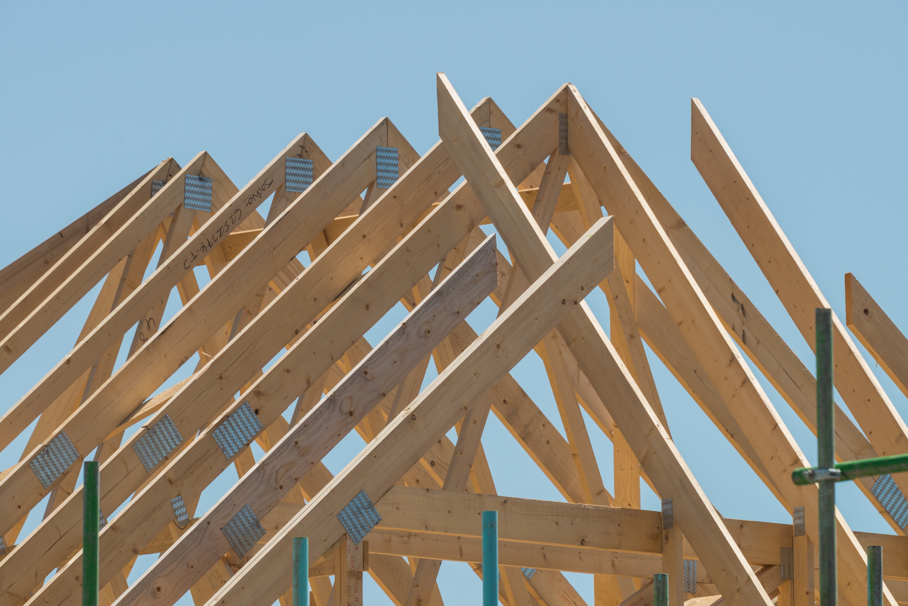 Timber,Roof,Under,Construction,At,New,Housing,Development.