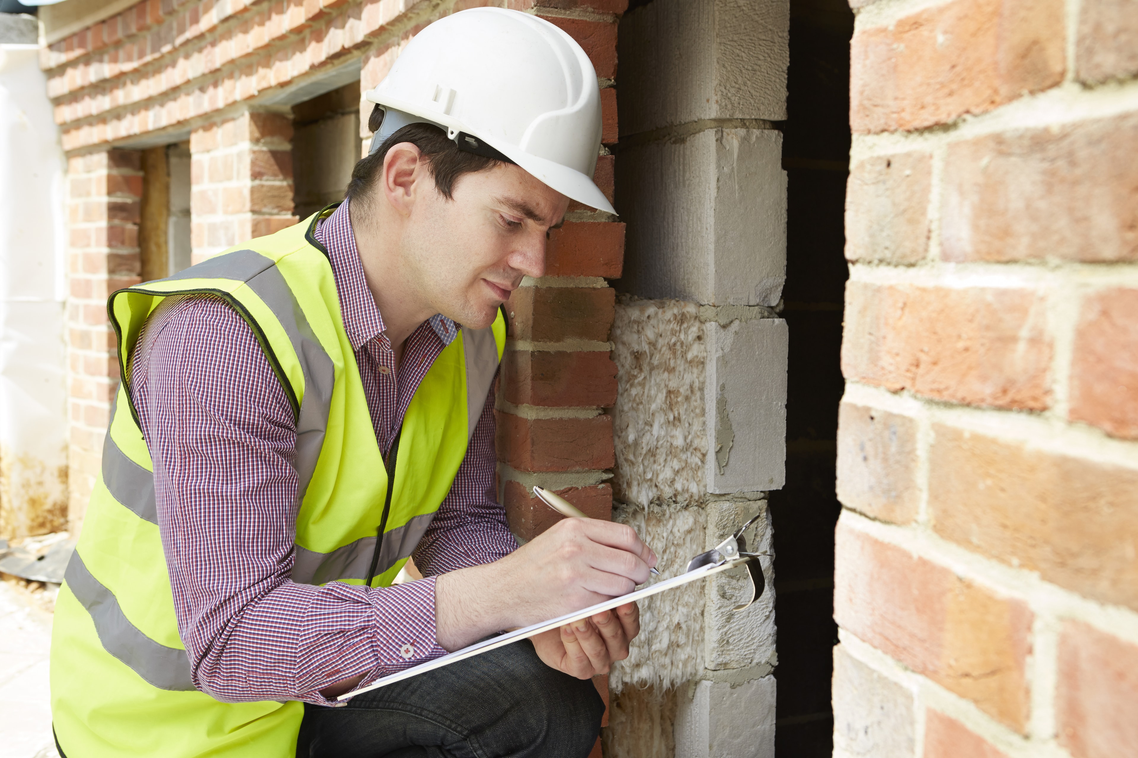 Architect,Checking,Insulation,During,House,Construction